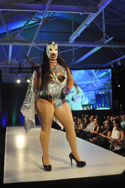 A model showcases the designs of Gosha at the fashionSPARK fashion show held on Sept. 16 at CAM Raleigh. The face mask and other details of the handmade sequin appliques in the outfits are in homage to Lucha Libre and Mexican wrestling as whole.
