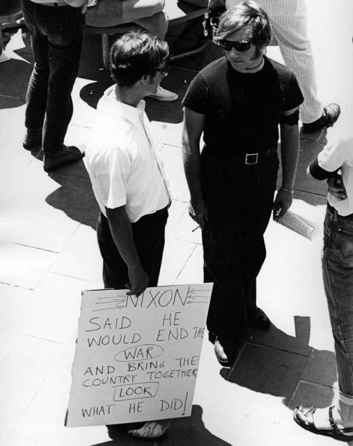 1970: Student holds a sign reading, &#8220;Nixon said he would end the war and bring the country together. Look what he did!&#8221;