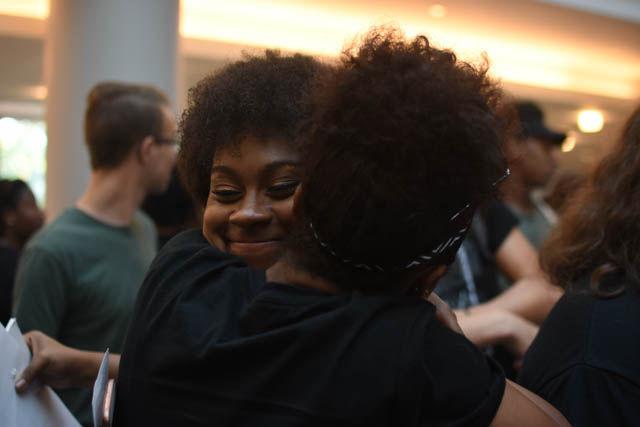 Achaia Dent, a sophomore studying animal science and organizer of the blackout event, hugs a student at the end of the blackout event.