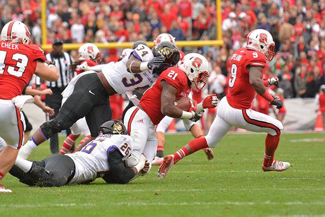 Then-freshman running back Matt Dayes is tackled while running the football during the football game against East Carolina in Carter-Finley Nov. 23, 2013. The Pirates defeated the Wolfpack 42-28, dropping NC State to 3-8 on the season.&#160;