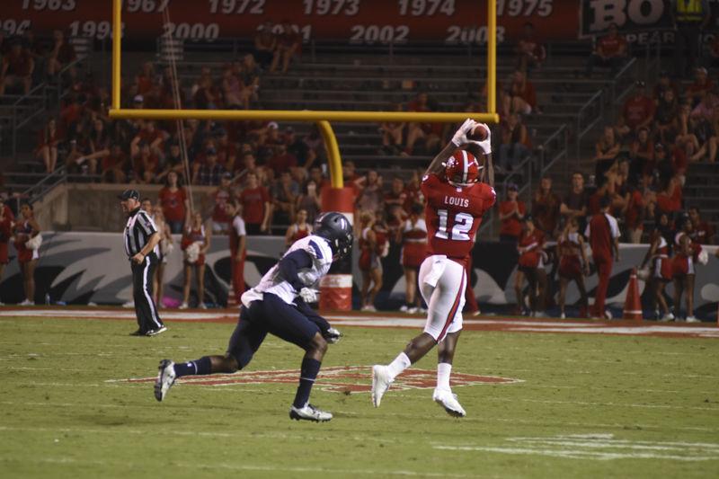 Junior wide receiver, Stephen Louis, catches the football near the sideline at Carter-Finley Stadium on Sept. 17. Louis caught five passes for 80 yards against Old Dominion.