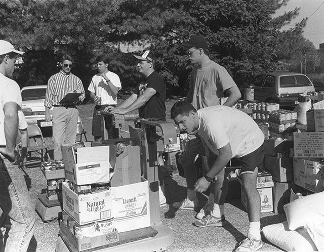 Circa 1980: Fraternity brothers are seen working during the Interfraternity Council food drive.&#160;