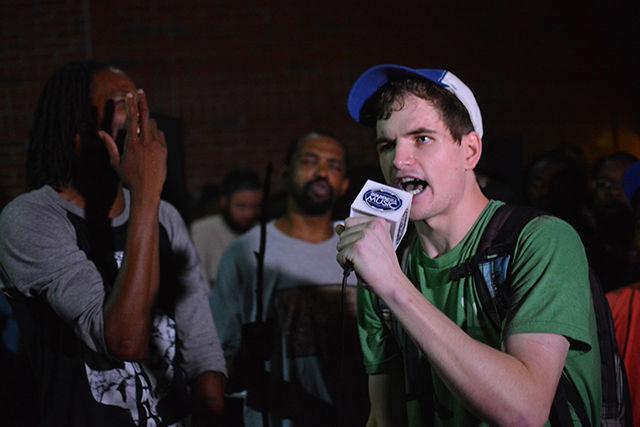 Anderson Burrus, a senior studying mass media communication, performs a freestyle rap in front of the Free Expression Tunnel during NC State Cypher's five-year anniversary on Aug. 24, 2015.