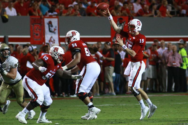 Redshirt sophomore quarterback Ryan Finley throws a dump pass to a teammate in the Wolfpack's home opener on Sept. 1. Finley completed 17 of 21 passes and threw for 174 yards and two touchdowns in the Wolfpack's 48-14 win over the Tribe at Carter-Finley Stadium.