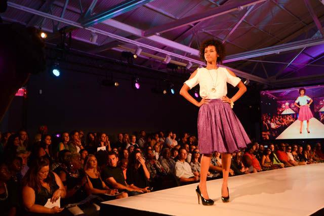 A model showcases one of the outfits in the "Broadway Squared" collection by designer MaryAshlyn Thomas. The collection was inspired by Thomas' daily commute and featured pieces that can be easily transitioned from day to night. MaryAshlyn was one of the eight designers featured at the Wear What You Are fashion show held on Sept. 16 at CAM Raleigh as part of SPARKcon.