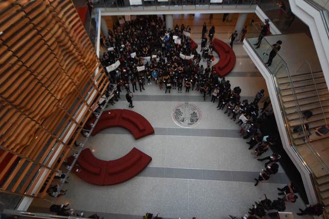 NC State students gather in Talley Student Union on Sept. 23 for the NC State Blackout in protest of the police brutality occurring across the nation. The peaceful protest began in Wolf Plaza and moved to the atrium of Talley Student Union for the die-in.