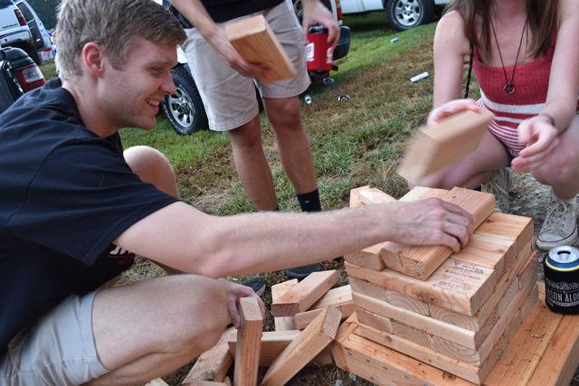 On Sept. 1, Rob MacPherson, a senior studying electrical engineering, puts together a homemade Jenga set at the first tailgate of the season at Carter-Finley Stadium. MacPherson says the Jenga game is popular at the tailgate and many people come to join in on the fun.