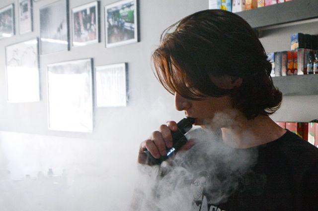 Spencer Morris, a Wake Tech student and Good Guy Vapes employee, exhales vapor from his vape. New vaping regulations imposed by the FDA limit products that can be sold in stores due to tightened manufacturing regulations.&#160;