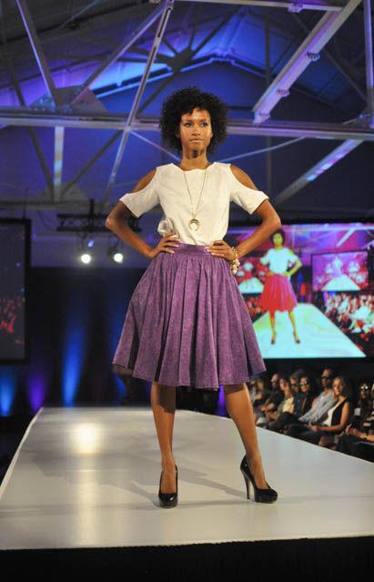 A model for Broadway Squared by MaryAshlyn Thomas wears a piece inspired the designer's daily commute. The custom prints and silhouettes are reflections of the crepe myrtle trees and highway overpasses she sees every morning. Each garment was designed to transition from day wear to night wear.