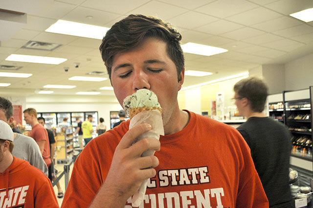 Logan Van Staalduinen, a freshman studying business, enjoys some of his favorite Howling Cow ice cream in Talley Student Union. Students who cheered on the NC State women's volleyball team on Saturday night against Southern Methodist University enjoyed some late night ice cream to celebrate the win. The volleyball match was one of the first sporting events to be held in the newly renovated Reynolds Coliseum.