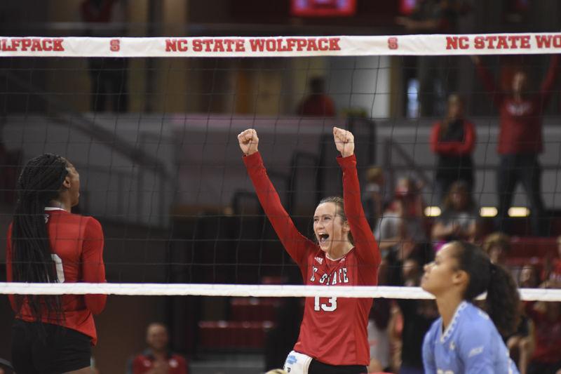 Senior setter Maggie Speaks pumps her fists into the air after scoring a point against UNC-Chapel Hill at Reynolds Coliseum on Sept. 22. Speaks recorded five spikes, five kills and one block in the Wolfpack's 3-2 loss to UNC-Chapel Hill.