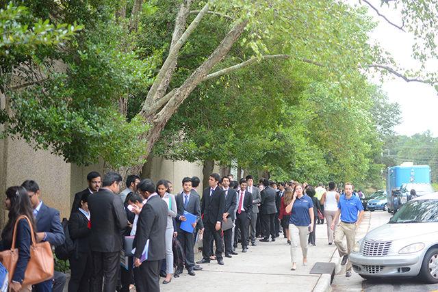 Students line up outside the McKimmon Center before the Engineering Career Fair begins on Tuesday. The career fair took place on Tuesday and Wednesday, with more than 300 companies present. Both undergraduate and graduate students attended the fair in hopes of obtaining internships, co-ops and post-graduation jobs.&#160;