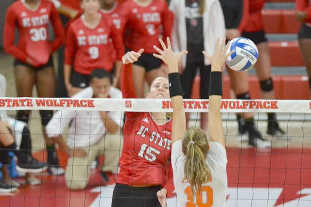 Junior middle blocker Kaitlyn Kearney spikes the ball past a Campbell player. The NC State volleyball team beat Campbell 3-1 at Reynolds Coliseum on Saturday.