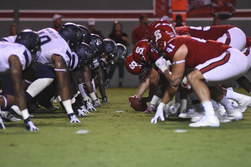 NC State players on the line of scrimmage get ready to snap the ball at the Old Dominion game at Carter Finley Stadium on Sept. 17. NC State won 49 to 22 against the Monarchs on Saturday night.