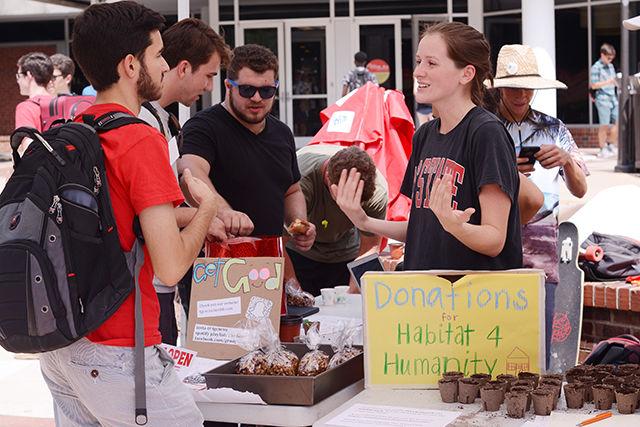 


Alex Hornaday, a freshman studying environmental sciences , talks with Eleanor Williams, a senior studying human biology,
over succulents and snacks in the Brickyard Wednesday. The succulents and granola being offered to students were brought
to NC State by The Good Club, a &#8220;student community focused on spreading health and happiness on campus.&#8221; Students were asked to donate money in order to take a succulent or bag of granola home, and all the proceeds from the event will go the Habitat for Humanity, and also to help out the NC State Cypher, which happens right outside the Free Expression Tunnel every Monday at 9 p.m. The Good Club will be hosting the event &#8220;Succulents and Snacks&#8221; again next week on Tuesday in the same location.&#160;


