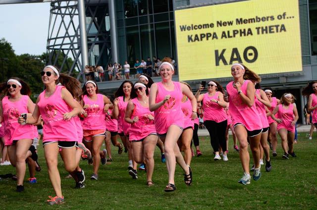 The new intiate class of Kappa Alpha Theta sorority rushes across Stafford Commons on Bid Day to greet their newly found sisters on September 14.