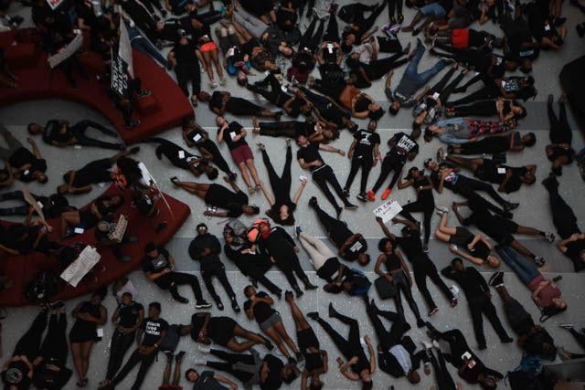 NC State students fill the Talley Student Union atrium on Sept. 23 for a die-in as a form of nonviolent protesting. Students laid down and filled the floor to represent those who have been unfairly murdered.