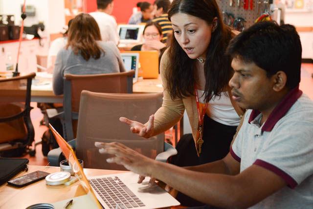 Lauren Di Monte, an NCSU Libraries Fellow, helps Hasan Shahariar, a PhD student studying fiber and polymer science with creating "recipes" on IFTTT, If This, Then That, at the Making Space workshop at D.H. Hill Library on Monday, Sept. 19. The workshop was part of the Making Space Event Series, which has been held at D.H. Hill Library since Feb. 2, 2016 and serves to educate women about access to technology and encourage more students to use the Makerspace.