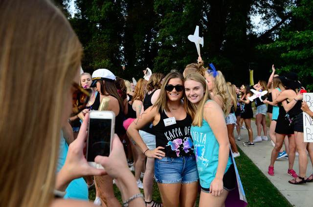 Kelly Daigle, a junior studying fashion and textile management, poses for a picture with Paige Doyle, new intiate into kappa delta and a freshman studying life sciences, during Bid Day on Stafford Commmons on September 14.