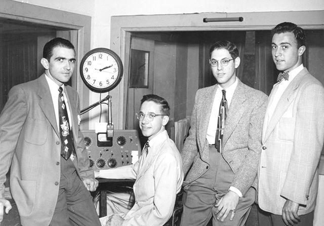 Circa 1960: DJs pose at the radio station.&#160;