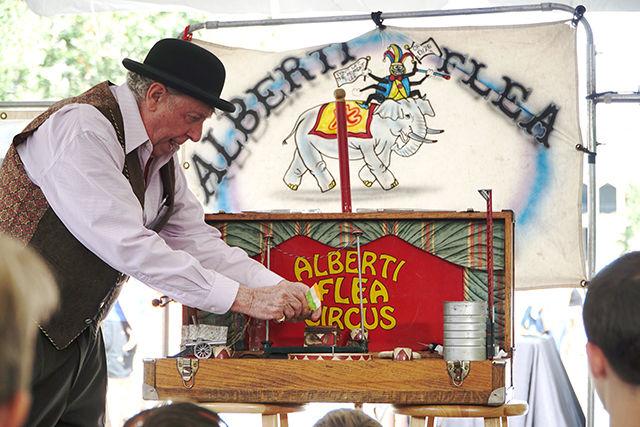 Jim Alberti performs an act as part of the Alberti Flea Circus at BugFest on Sept. 19, 2015. The Alberti Flea Circus started in the 1880s and has remained in the family. Alberti has been performing at BugFest for six years.
