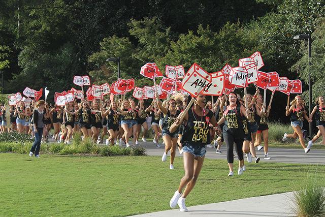 Members of Zeta Tau Alpha run across Stafford Commons to congratulate their new sisters. Bid Day, the final event in sorority recruitment, took place on Sept. 16, 2015.