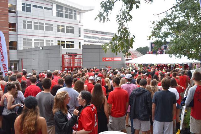 Students wait in front of Carter-Finley Stadium to enter the first home game of the season on Sept. 1. Students showed their IDs with their tickets to be to enter the stadium. Security at Carter-Finley Stadium implemented a new clear bag policy that heavily affected the students' entrance into the event.