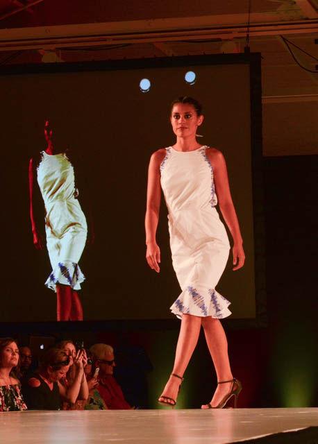 A women models one of the outfits from "Anna Gray Designs" by Anna Dougherty. The collection was inspired by Pittsburgh with the prints specifically inspired by the Roberto Clemente Bridge and the Pittsburgh skyline. The collection was one of the eight collections featured at the Wear What You Are fashion show held on Sept. 16 at CAM Raleigh as part of SPARKcon.