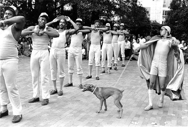 Circa 1980: Brothers of Omega Psi Phi perform a step routine in front of the Free Expression Tunnel.&#160;