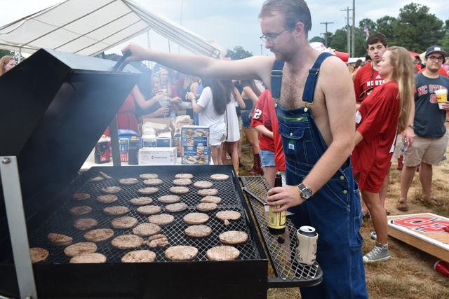 James Stonecypher, a junior studying environmental technology and management, grills at the William &amp; Mary football game held at Carter-Finley Stadium on Sept. 1.&#160;