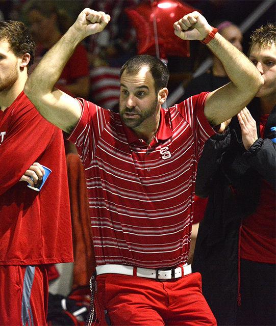 Head coach Braden Holloway cheers on then-freshman Anton Ipsen as he competes in the 1,000-yard freestyle during NC State's meet with rival UNC-Chapel Hill Jan. 31, 2015 at the Casey Aquatic Center. Ipsen finished first in the event with a time of 8 minutes and 55.70 seconds. The No. 8 Wolfpack men's team remained undefeated, beating the No. 20 Tar Heels 180-118. The No.12 women's team just barely missed topping the No. 5 Tar Heel women 146.5-134.5.