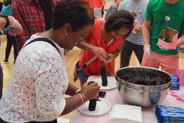 Valencia Taylor and her daughter Doriane Taylor, a senior studying chemistry, compete in an Oreo stacking competition hosted by the Inter-Residence Council and the National Society for Residence Halls at the thriteenth annual Chocolate Festival while in the State Ballroom in Talley Student Union on Sept 30.
