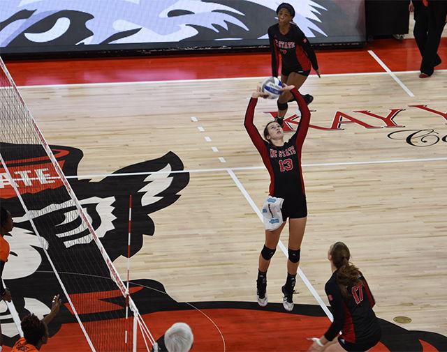 Maggie Speaks sets the ball against the Big Orange. Speaks had five spikes in the game on Friday at Reynolds Coliseum. The Pack defeated Syracuse 3-2.