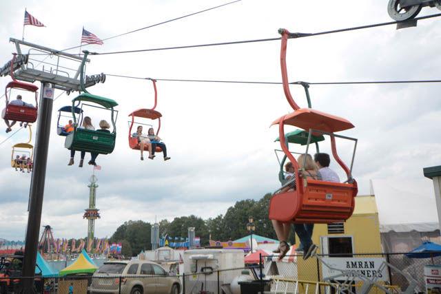 Fairgoers take a ride on The State Fair Flyer, the newest permanent addition to the fair, for an opportunity to see the fair from up high. Tickets are $5 for a one-way trip and $8 for a roundtrip. The 149th annual NC State Fair featured a variety of attractions including animals, rides, food and more.