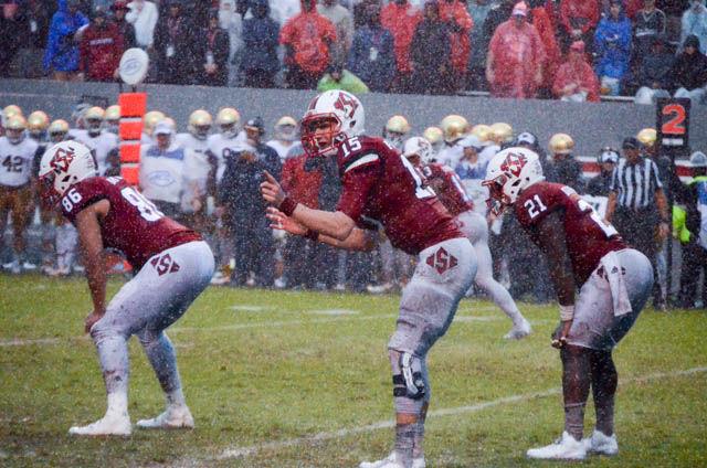 Redshirt sophomore quarterback Ryan Finley looks over to the sideline before a play during the game against Notre Dame on Oct. 8. The Wolfpack won a hard fought game 10-3 during Hurricane Matthew. The game celebrated the 50th anniversary of Carter-Finley Stadium.