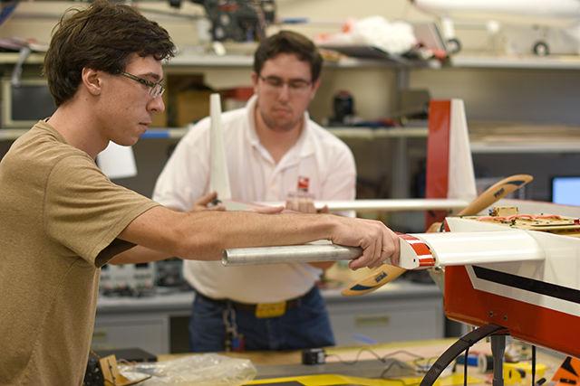 Teammates Hayden Pernia, a senior studying mechanical engineering, and Kenneth Woodby, a junior studying aerospace engineering, assemble an Aerial Robotics Club&#8217;s craft. The meeting on Sept. 30 in Engineering Building III allowed the team to work together on the Fenrir III, which is the club&#8217;s newest aircraft. Pernia said, "We came in third at competition last year, and we really would like to take first this year."
&#160;