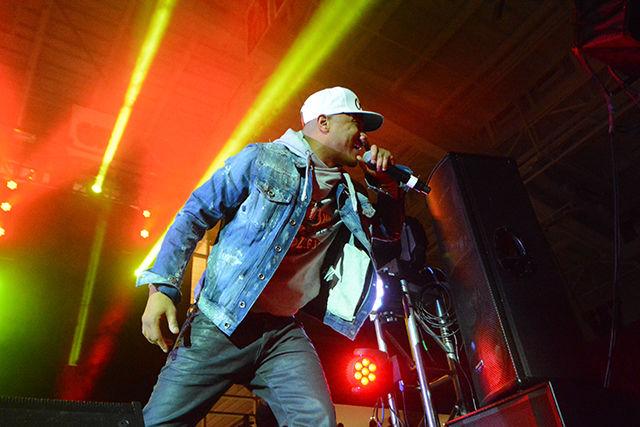 T.I. leans toward the crowd as he sings at this year's PackHowl concert. The concert is a part of NC State's Red and White Week. NC State student Jordan Williams, under the stage name Sonny Miles, and rapper MadeinTYO opened for T.I. The concert took place in Reynolds Coliseum on Wednesday.