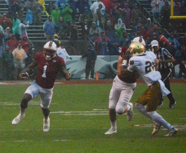 Junior tight end Jaylen Samuels carries the ball down the sideline during the Wolfpack's 10-3 win against Notre Dame on Oct. 8. Samuels had four carries for 16 yards and a reception for six yards in a hard fought game. The game was also the 50th anniversary of the first game played in Carter-Finley Stadium.