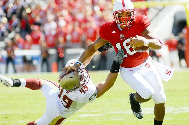 Redshirt junior quarterback Russell Wilson runs the ball during the Oct. 9, 2010 game against Boston College in Carter-Finely Stadium. Wilson had total of 45 rushing yards during the game. NC State won against Boston College, 44 - 17.&#160;