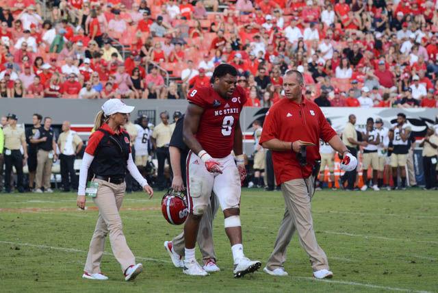 Junior defensive end Bradley Chubb walks off the field after getting injured during the game. NC State won the game 33-16 against Wake Forest on Oct. 1.