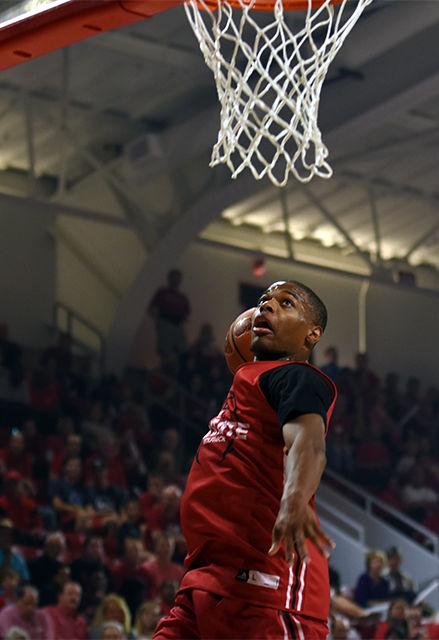 Freshman Dennis Smith Jr. dunks during the Red vs. White scrimmage at Primetime with the Pack in Reynolds Coliseum on Friday. Smith put up 12 points for the red team. The white team clinched victory over red with a final score of 59-55.