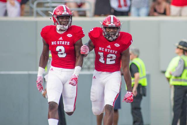 Sophomore wide receiver Stephen Louis celebrates with freshman wide receiver Kelvin Harmon after Harmon's first touchdown. The Wolfpack ended the Demon Deacons' hot streak with a 33-16 victory on Oct. 1 in Carter-Finley Stadium.