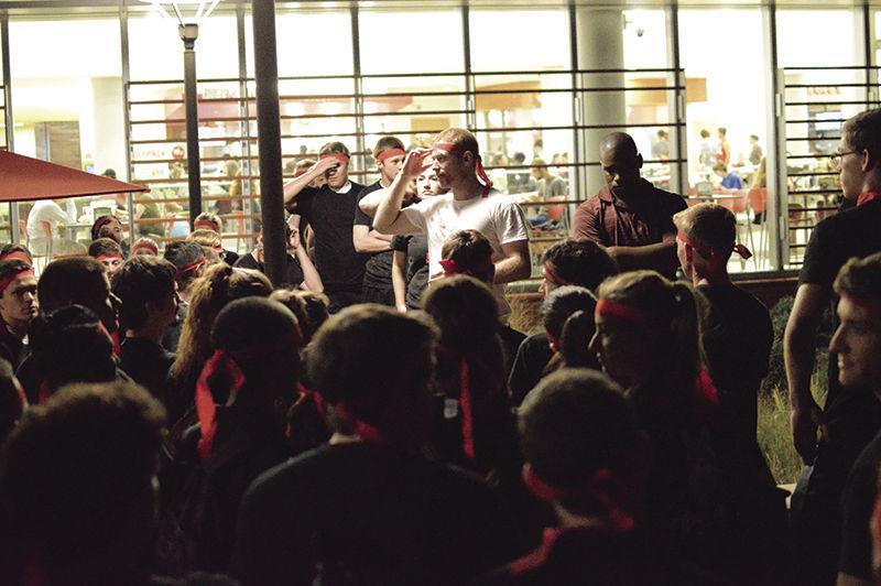 Thomas Christianson, the deputy event organizer and first lieutenant from Fort Bragg, explains rules before Survive Raleigh VII on Saturday, beginning at Talley Student Union. Survive Raleigh is an escape and evasion game that takes place on campus, where players begin as "humans" and race through check points while being hunted by "zombies."&#160;