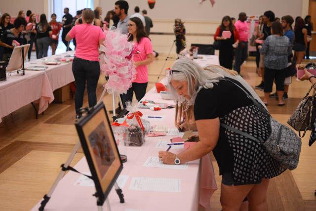 Sherry Mullies, a Chocolate Festival attendee, places a bid on an item part of the auction at the Chocolate Festival on Friday, Sept. 30 in the State Ballroom in Talley Student Union. The Chocolate Festival is an annual event sponsored by the NC State Women's Center in an effort to raise money for the Women's Center and the Kay Yow Cancer Fund. Attendees paid an entrance fee of $10 to sample a variety of choclate treats from local vendors.