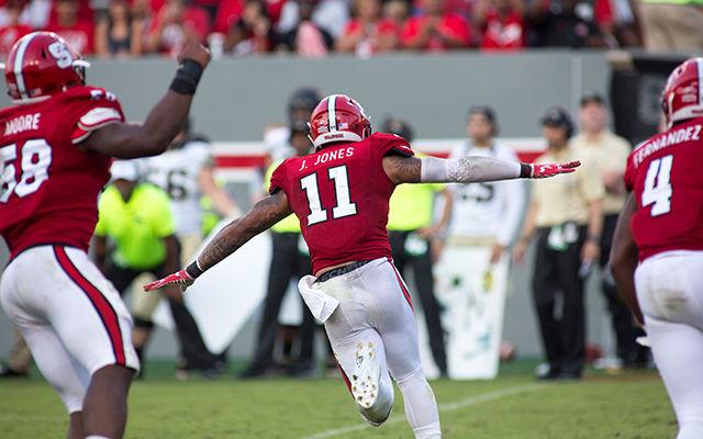 Redshirt junior safety Josh Jones flies off the field after making a play. The Wolfpack ended the Demon Deacon hot streak with a 33-16 victory on Saturday in Carter-Finley Stadium.