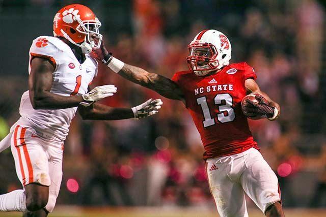 Junior wide receiver Bra'Lon Cherry siffarms Clemson's safety Jayron Kearse who eventually forces him out of bounds. Cherry had three receptions for 38 yards during homecoming. The Wolfpack lost 56-41 to Clemson on Oct. 31, 2015 in Carter-Finley stadium.