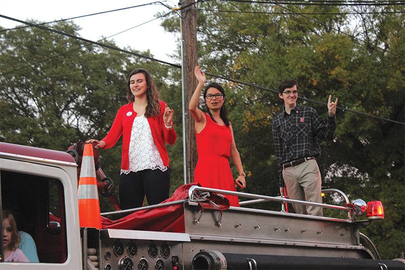 Leader of the Pack finalists Kati Scruggs, Meredith Biechele and Mitchell Moravec ride a firetruck in the homecoming parade on Friday. The Leader of the Pack Program recognizes students who excel in the areas of leadership, scholarship and community service.