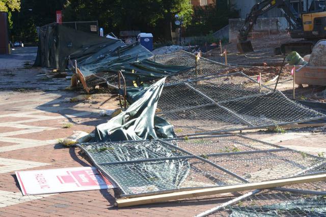 The fence surrounding Harrelson Hall's demolition site gets struck down by recent Hurricane Matthew.