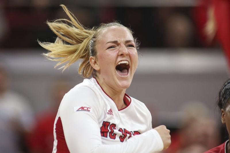 Senior libero Rachel Eppley cheers in excitement after winning the final point in a set over No. 12 UNC. Eppley led the team in digs with 22 and in service aces with two. Though the Pack led 2-1, it fell in the end 3-2 in Reynolds Coliseum on Sept. 12.
