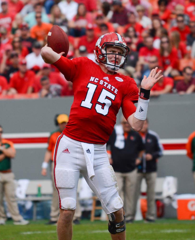 Redshirt sophomore quarterback Ryan Finley passes the ball during the Miami game at Carter-Finley Stadium on Saturday. Finley passed for 210 yards and rushed for 23 yards. The final score was 13-27 in favor of Miami.
